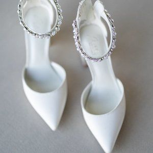 Ivory pointed toe satin block heels with crystal strap